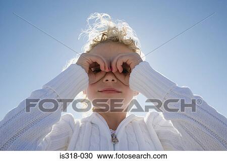 Girl looking through hands View Large Photo Image Stock Image - Girl looking through hands. Fotosearch