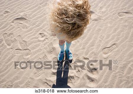 Girl on standing beach, Overhead view) View Large Photo Image Stock Photo - Girl on standing beach, Overhead view). Fotosearch