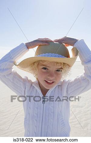 Girl wearing straw hat on beach View Large Photo Image Stock Image - Girl wearing straw hat on beach. Fotosearch