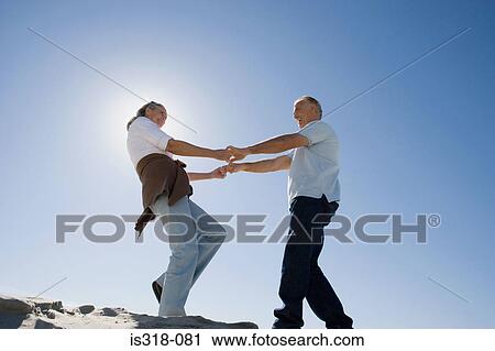 Senior couple dancing on beach View Large Photo Image Stock Image - Senior couple dancing on beach. Fotosearch