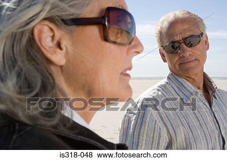 Senior couple wearing sunglasses View Large Photo Image Stock Photo - Senior couple wearing sunglasses. Fotosearch