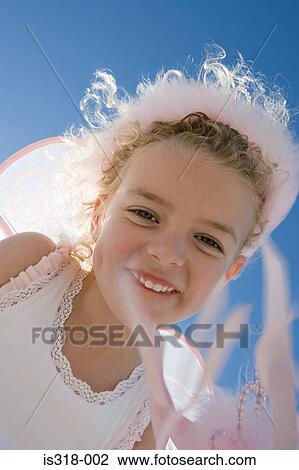 Stock Image - Smiling girl with wings. Fotosearch