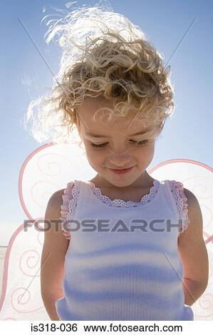 Smiling girl with wings, View Large Photo Image Stock Photograph - Smiling girl with wings,. Fotosearch