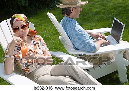 Senior couple in the garden View Large Photo Image Stock Photograph - Senior couple in the garden. Fotosearch