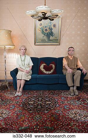 Stock Photo - Senior couple on sofa. Fotosearch
