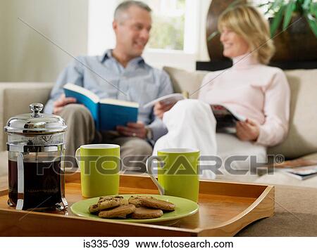 Couple having coffee at home View Large Photo Image Stock Photo - Couple having coffee at home. Fotosearch