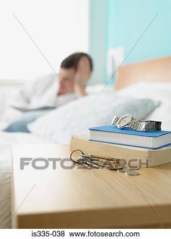 Stock Photo - Items on a bedside table. Fotosearch