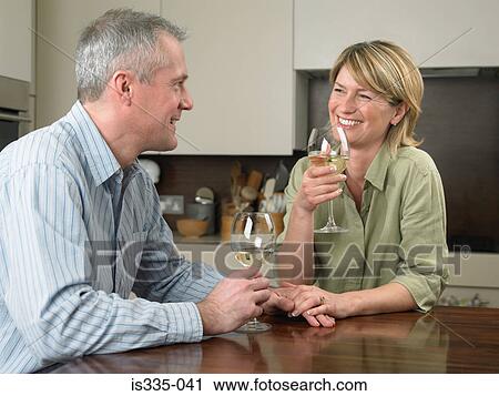 Mature couple drinking wine View Large Photo Image Stock Image - Mature couple drinking wine. Fotosearch