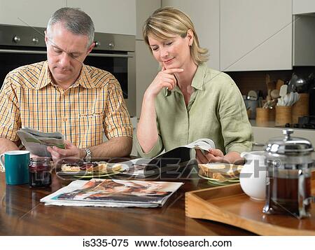 Stock Photography - Mature couple having breakfast. Fotosearch