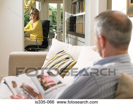Mature couple resting at home View Large Photo Image Stock Photograph - Mature couple resting at home. Fotosearch