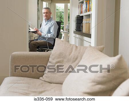 Stock Photo - Mature man at home. Fotosearch