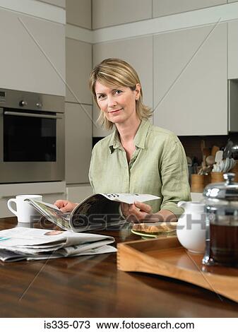 Mature woman having breakfast View Large Photo Image Stock Image - Mature woman having breakfast. Fotosearch