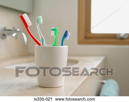 Toothbrushes in a cup View Large Photo Image Stock Image - Toothbrushes in a cup. Fotosearch