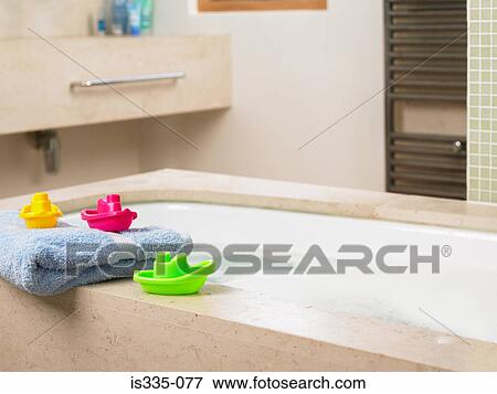Toy boats on edge of bath View Large Photo Image Stock Photo - Toy boats on edge of bath. Fotosearch