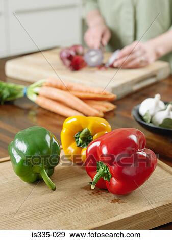 Woman cutting vegetables View Large Photo Image Stock Photo - Woman cutting vegetables. Fotosearch