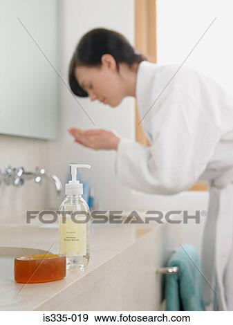 Stock Photo - Woman washing her face. Fotosearch