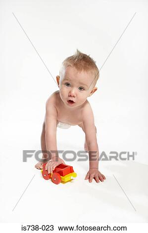 Baby with toy train View Large Photo Image Stock Image - Baby with toy train. Fotosearch