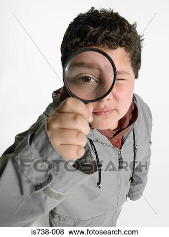 Stock Photo - Boy with a magnifying glass. Fotosearch