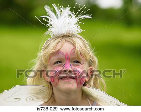 Stock Photo - Girl with a butterfly painted on his face. Fotosearch