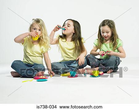Girls having a tea party View Large Photo Image Picture - Girls having a tea party. Fotosearch