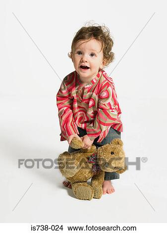 Toddler with a teddy bear View Large Photo Image Picture - Toddler with a teddy bear. Fotosearch