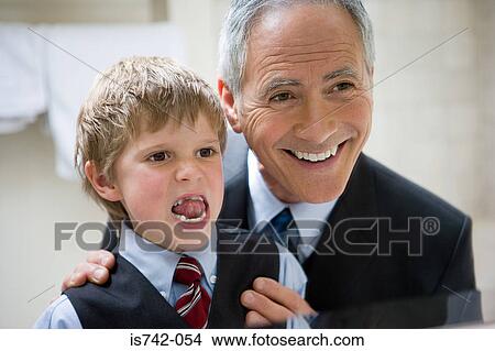 Boy and grandfather looking in mirror View Large Photo Image Picture - Boy and grandfather looking in mirror. Fotosearch