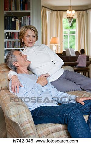 Couple listening to girl play piano View Large Photo Image Stock Photograph - Couple listening to girl play piano. Fotosearch