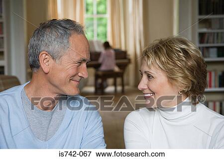 Stock Photo - Couple looking at each other. Fotosearch