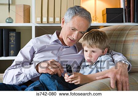 Man and grandson with cell phone View Large Photo Image Stock Image - Man and grandson with cell phone. Fotosearch