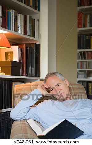 Man reading a book View Large Photo Image Stock Image - Man reading a book. Fotosearch