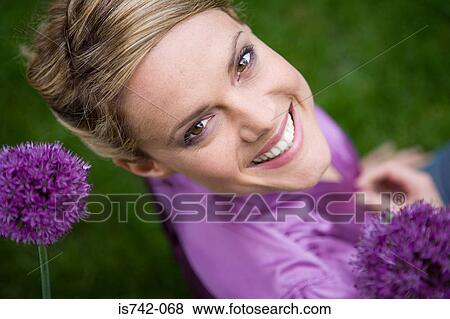 Woman amongst allium flowers View Large Photo Image Stock Photo - Woman amongst allium flowers. Fotosearch