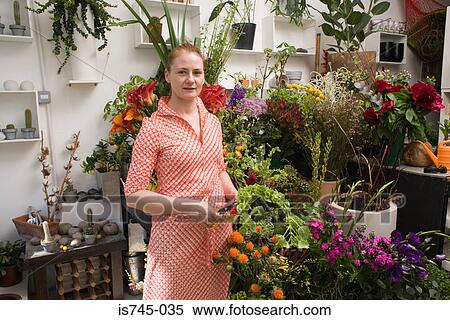 Stock Photography - Florist preparing flowers. Fotosearch