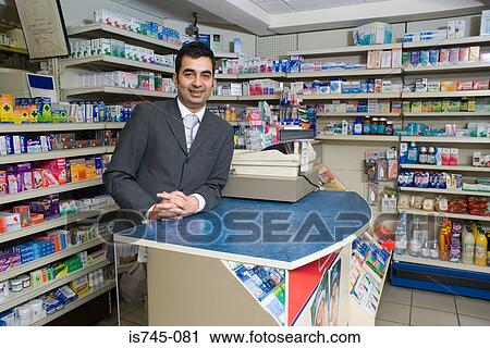 Stock Image - Pharmacist at counter. Fotosearch