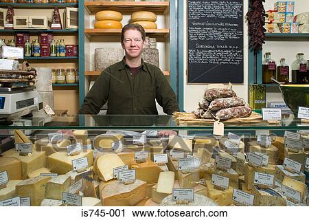 Stock Image - Portrait of a cheesemonger. Fotosearch
