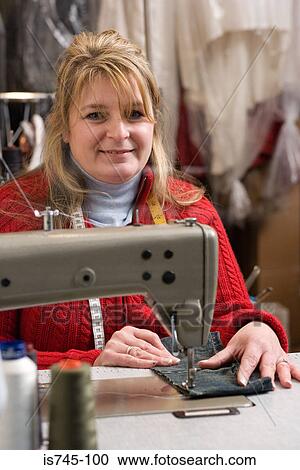 Seamstress sewing View Large Photo Image Stock Image - Seamstress sewing. Fotosearch
