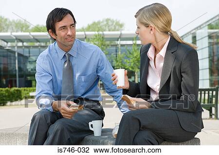 Businesswoman and businessman eating sandwiches outdoors View Large Photo Image Stock Image - Businesswoman and businessman eating sandwiches outdoors. Fotosearch