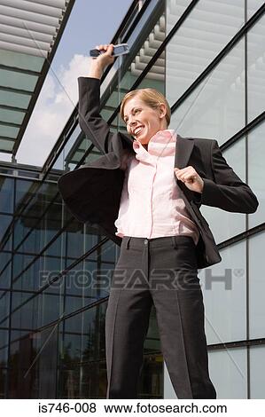 Stock Photo - Businesswoman jumping outdoors. Fotosearch