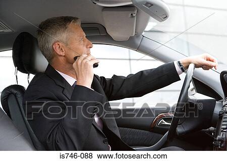 Man shaving with electric razor in car View Large Photo Image Stock Photo - Man shaving with electric razor in car. Fotosearch
