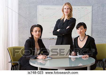 Three young women conference room View Large Photo Image Stock Image - Three young women conference room. Fotosearch