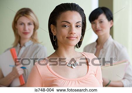 Three young women posing indoors View Large Photo Image Picture - Three young women posing indoors. Fotosearch