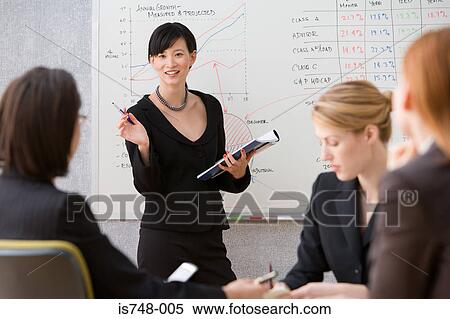 Stock Photography - Young woman giving lecture. Fotosearch