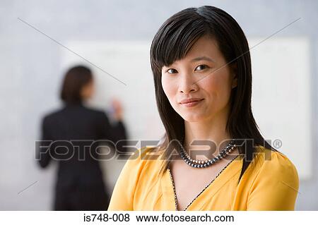 Young woman in classroom View Large Photo Image Stock Photo - Young woman in classroom. Fotosearch