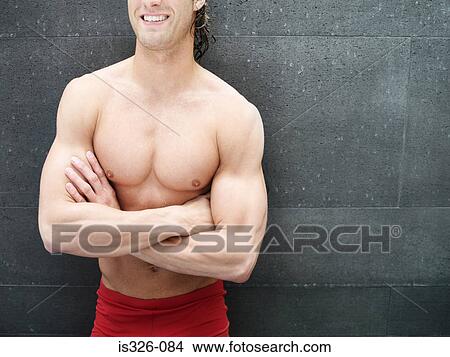Picture - Man leaning by wall . Fotosearch