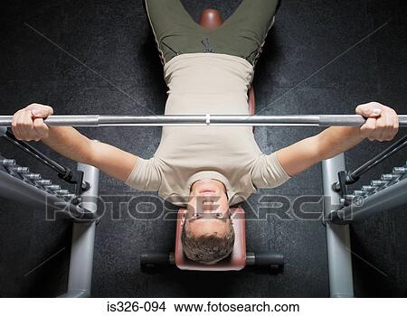 Man lifting barbell View Large Photo Image Picture - Man lifting barbell . Fotosearch