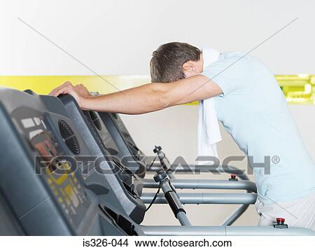 Man on treadmill in health club View Large Photo Image Picture - Man on treadmill in health club. Fotosearch