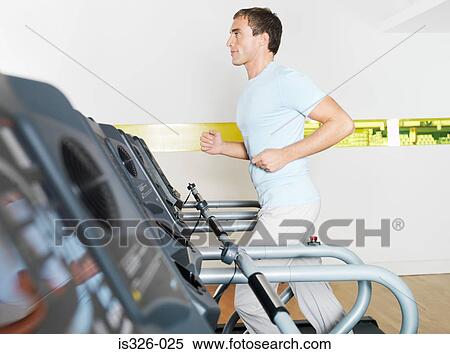 Man on treadmill in health club View Large Photo Image Stock Photography - Man on treadmill in health club. Fotosearch