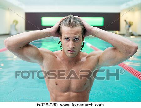 Man touching wet hair at swimming pool View Large Photo Image Stock Image - Man touching wet hair at swimming pool . Fotosearch