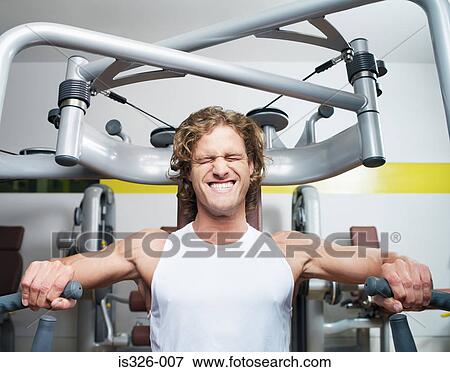 Man weight training View Large Photo Image Stock Photo - Man weight training. Fotosearch