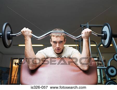Man weight training View Large Photo Image Stock Photo - Man weight training . Fotosearch