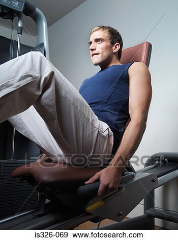 Man weight training View Large Photo Image Stock Photo - Man weight training . Fotosearch